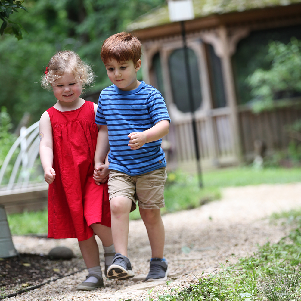 two kids holding hands